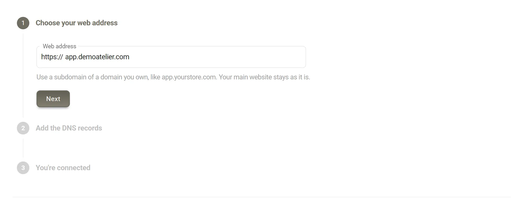 The Choose your web address step. The Web address field reads https://app.demoatelier.com, with a Next button below it.