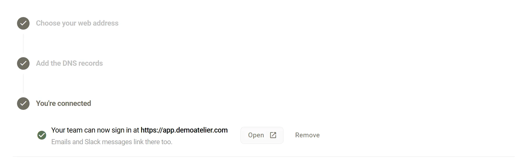 The You're connected step, with a green tick and the text Your team can now sign in at https://app.demoatelier.com. Emails and Slack messages link there too. Open and Remove buttons sit below.